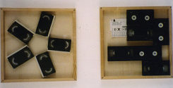 Andrea Natterer: MEDIENOBJEKTE I, II, 2002, 50x50cm, Holz, Plexiglas, Videokassetten